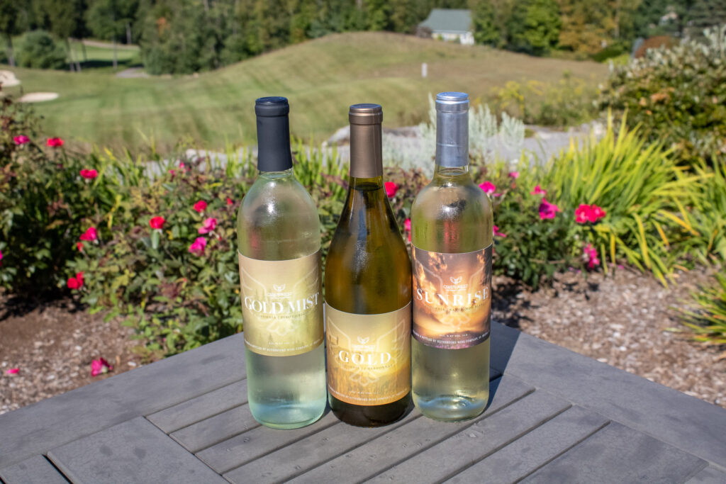 goldmist-and-sunrise-wines-on-table-with-scenic-background