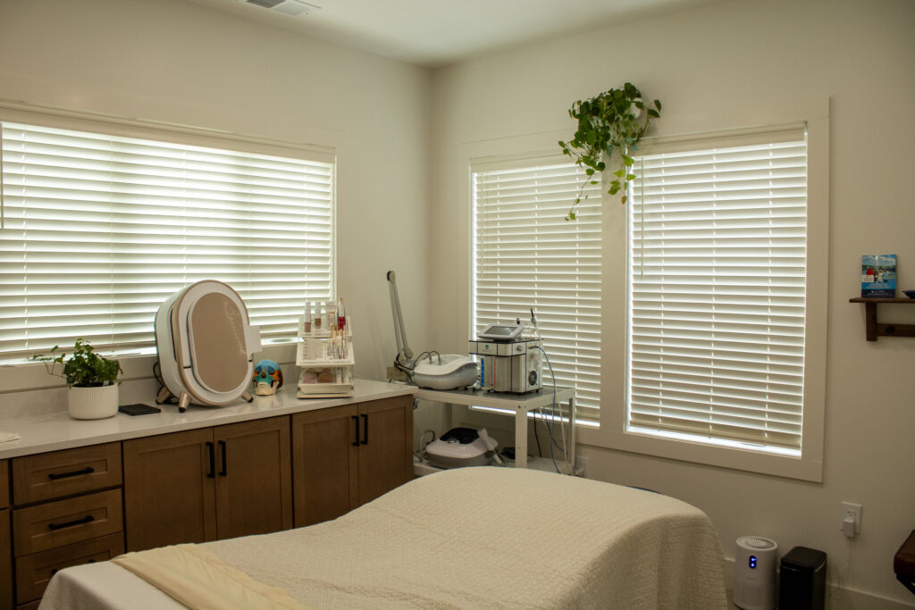 mid-state-treatment-room-with-skincare-equipment-and-massage-table