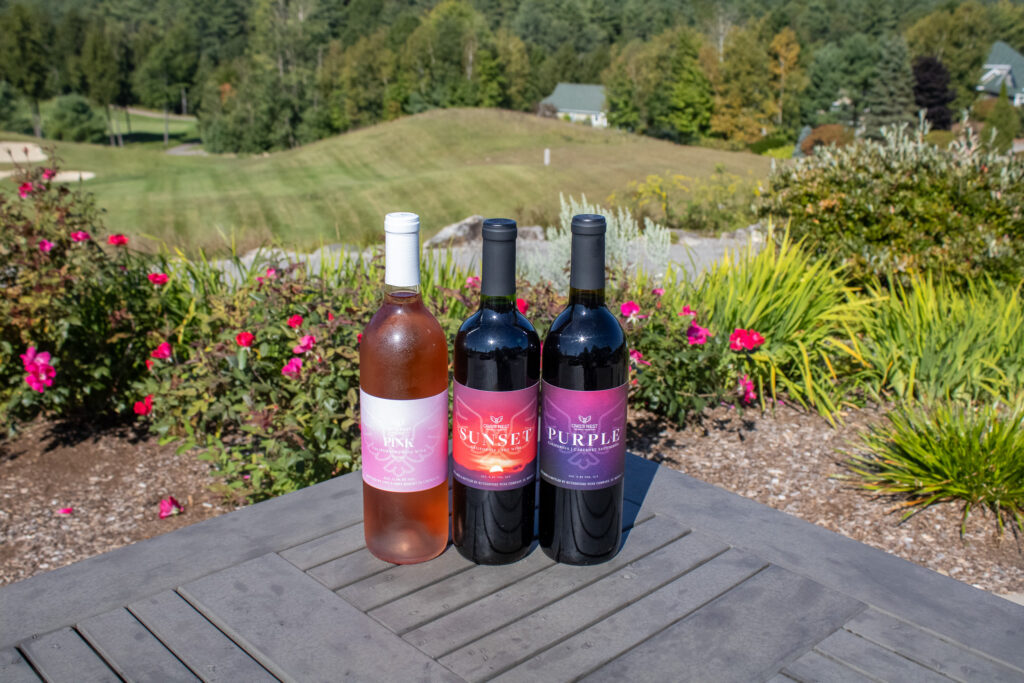 pink-and-red-wines-on-table-overlooking-golf-course